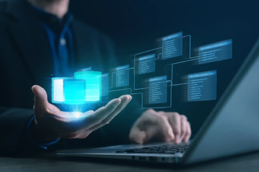 Business professional using laptop with holographic digital database projection — CXbuildr office infrastructure design and construction services.